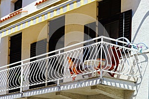 House with balcony on sea resort, sunny day, touristic concept.