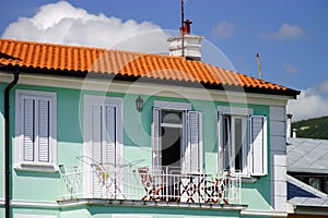 House with balcony on sea resort, sunny day, touristic concept.