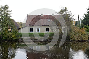 House on the bank of the Polessky Canal in the Kaliningrad region