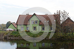 House on the bank of the Polessky Canal in the village of Belomorskoye, Kaliningrad region