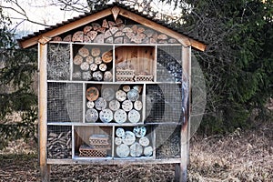 house for bees and insects made of different natural materials. Insect hotel or Shelter, empty bug hotel close up view. provide in