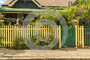 House behind cream picket fence