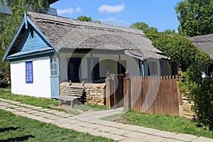 House with bench in Dimitrie Gusti National Village Museum in Bucharest photo