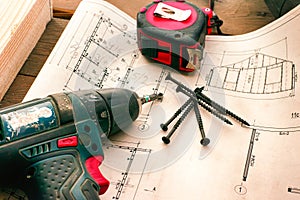 House blueprints with work tools