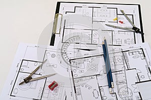 house blueprints with work tools drawing instruments on the worktable