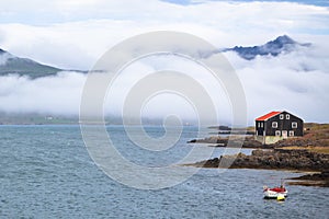 House and boat in East Iceland