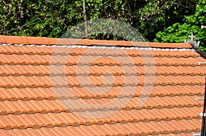 House building: detail of the roof with a multi-pitched roof, evident the ridge line and the sheaths un