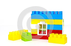 House building from lego bricks on a white