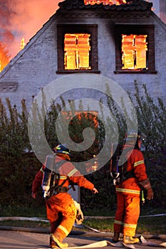 House burning and fire fighters