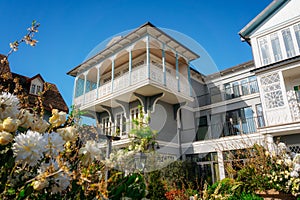 A house with a carved wooden balcony in the garden. Tbilisi, Gerogia