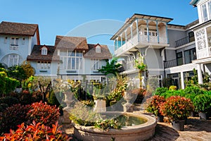 A house with a carved wooden balcony in the garden. Tbilisi, Gerogia