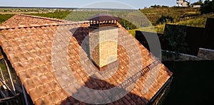 House with ceramic tile roof. cement-sand roof tiles