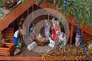 House Christmas Nativity,the birth of Jesus in the manger between the animals in a wooden house