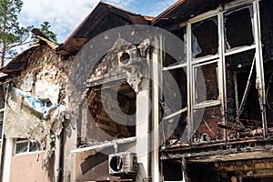 House in of civilians destroyed by russian soldiers. Atrocities of the russian army in the suburbs of Kyiv Irpin.