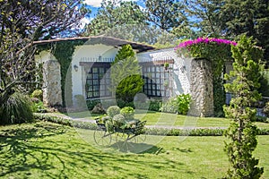 House with classic windows decorated with flowers garden la quebrada xela photo
