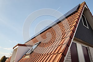 House with clean energy, solar panels installed on the roof