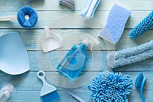 House cleaning plastic product on wood blue table background, home service or housekeeping concept, top view