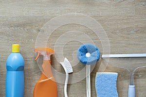 House cleaning plastic product on wood table background, home service or housekeeping concept