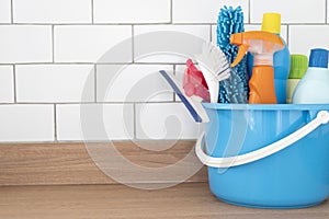 House cleaning plastic product on wood table with copy space background, home service or housekeeping concept