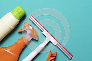 House cleaning product on green table background