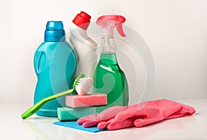House cleaning products and tools on white background.