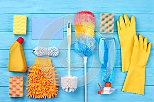 House cleaning set on wooden background.