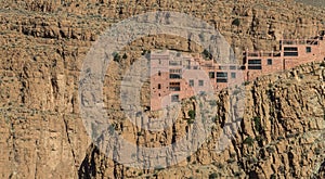 The house on the cliff of Gorges du Dades valley with small solar cell for electrical, Morocco