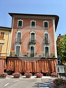 House with closed curtains and shutter in north Italy.