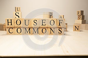 House of commons word from wooden cubes. Terms of economy state government