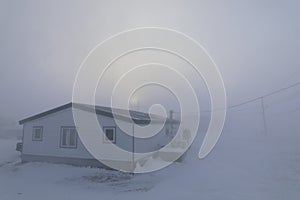 House almost completely gone under blizzard conditions in the Canadian Arctic