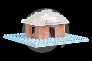 House constructed of toy building blocks