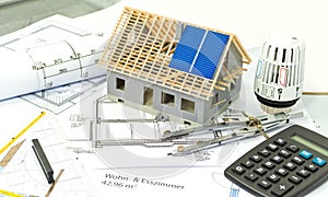 House with a construction plan and solar panel planning