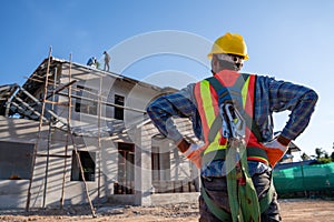 House construction, Working at height equipment for worker to install the roof. Fall arrestor device for worker with hooks for