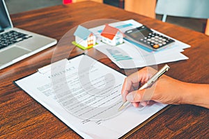 House Contract, Man signs a contract to purchase a home with a r