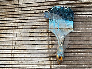 House contruction tool an old paint brush with blue color