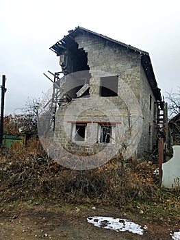 House damaged by an artillery shell photo