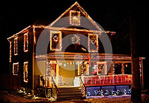 House decorated with Christmas lights at rural neighborhood