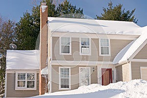 House in deep winter snow