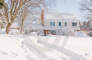 House in deep winter snow