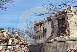 House demolition, destroyed building, broken collapsed walls, dismantling,