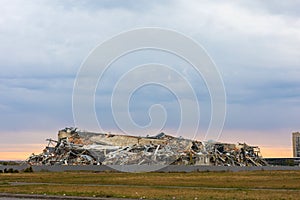 House destroyed. Apocalyptic landscape. The remains of destroyed houses at sunset