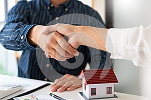 House developers and customer shaking hand after accept agreement finish buying or rental real estate for transfer right of