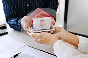 House developers and customer shaking hand after accept agreement finish buying or rental real estate for transfer right of