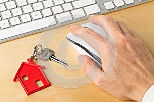 House door key with red house key chain pendant and computer key