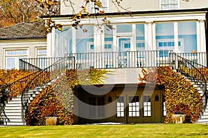 House with Double Staircase and Autumn Ivy