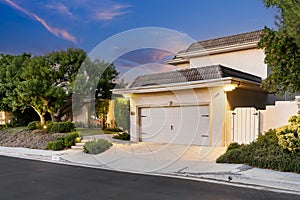 House at dusk, surrounded by greenery in Encino, California