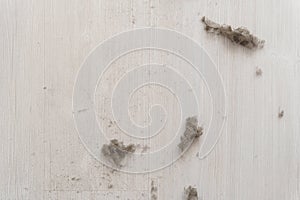 House dust on white floor. Top view. House Dust Mite and Home cleaning, Hygiene concept, Copy free space on Left