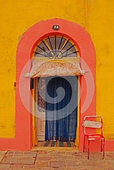 A beautiful colourful House Entrance at the seaside waterfront fishing village of Marsaxlokk, Malta