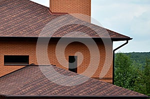 The house is equipped with high-quality roofing of shingles bitumen tiles. A good example of perfect roofing. The roof is reliabl