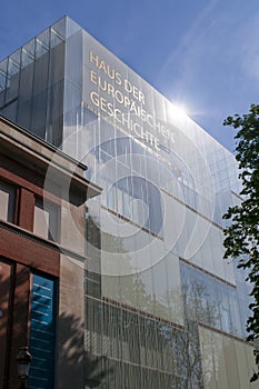 House of European History Haus der EuropÃÂ¤ischen Geschichte HEH In Brussels with sun reflecting from glass faÃÂ§ade